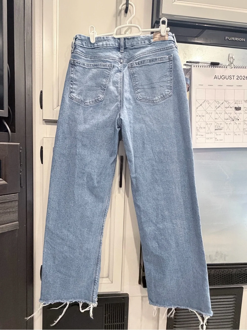 American Eagle Outfitters Light Blue Wide-Leg Jeans with Frayed Hem